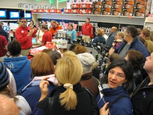 Enthusiastic shoppers gather around in the electronics department of Henrietta, NY's Target.